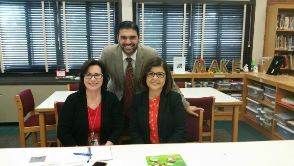 Gina Seymour, left, with principal Michael Mosca and ELL coordinator Claudia Osorio