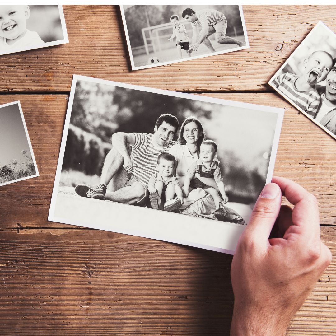 a person looking at old photos