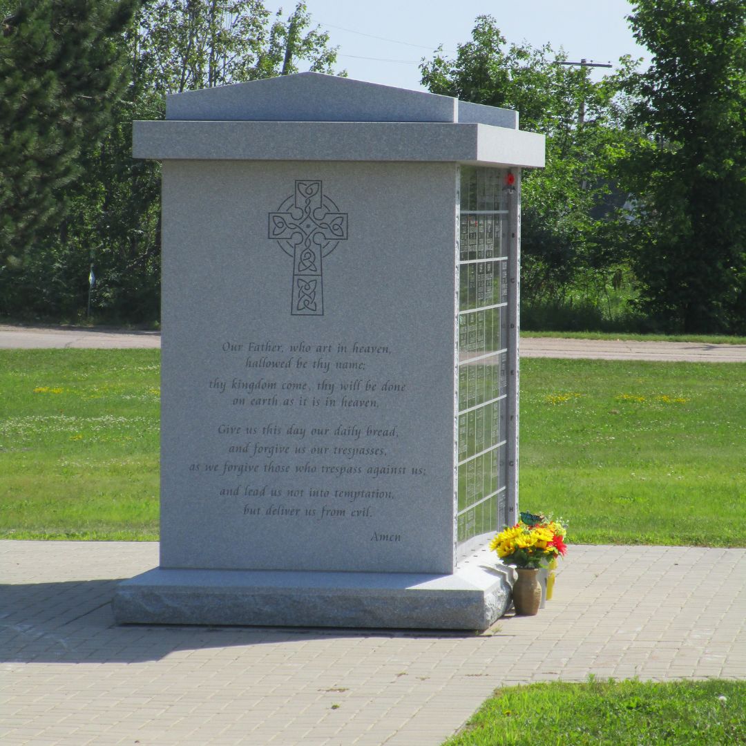 a memorial headstone in a graveyard
