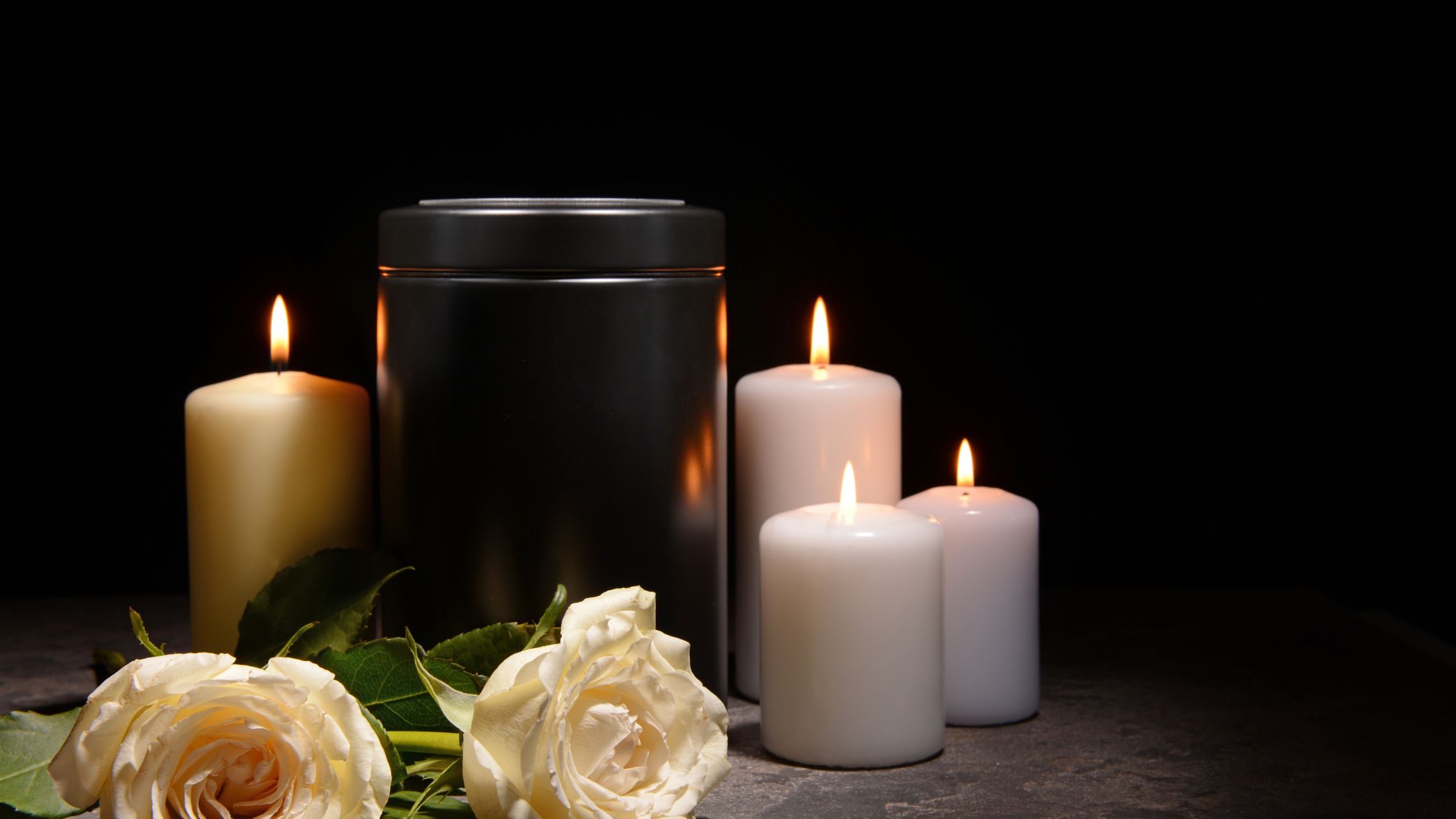 Urn surrounded by candles