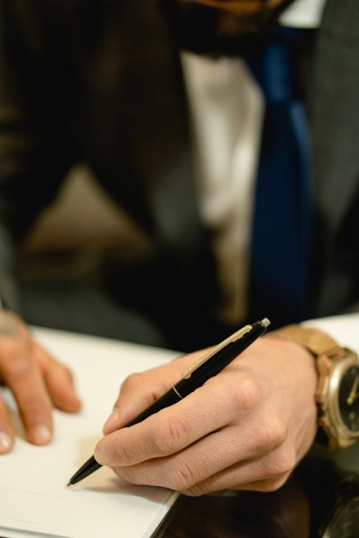 a man preparing legal documents and authorizations for a funeral service