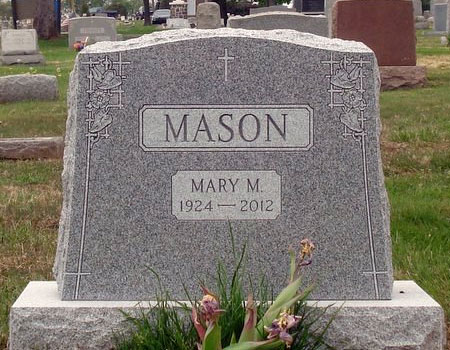 This is an upright custom stone in Barre Gray granite from Vermont. Note the carvings in the corners.