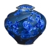 Campbell Midnight Star Cremation Urn  This porcelain cremation urn features spectacular colors and a unique, crisp design. It has a crystalline glaze, fired to create a broad range of sparkling blue colors. Since every porcelain urn is hand made, please allow for variances in the color intensity and design patterns