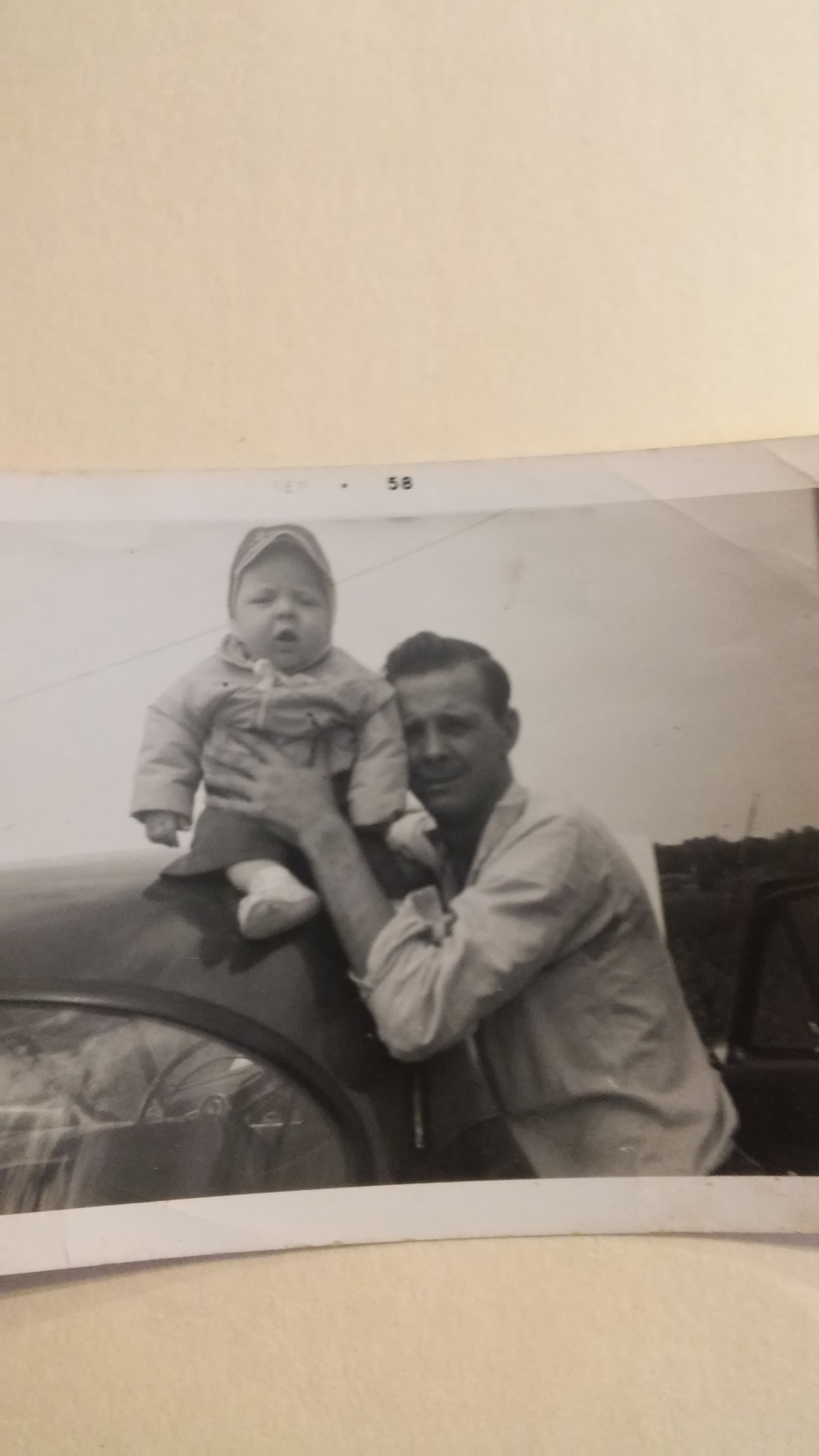 dad around 4 months old and grandpa clements