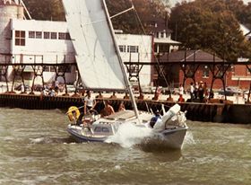 Jim at the helm of Lorie II leaving South Haven harbor