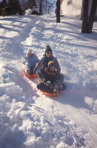 Thank you for getting this photo to me, Judy.&nbsp;&nbsp;Mark is in the center on the sled with Brian. I'm in the back.&nbsp;&nbsp;Such good memories at your house in those early years with the boys...playing in the pool, running through the woods way bac