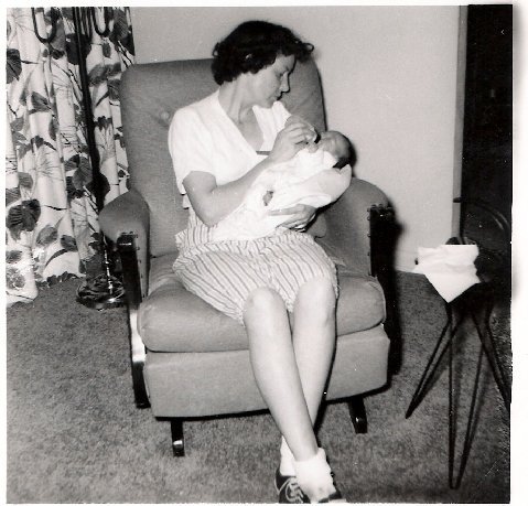 Aunt Ruthie holding her new daughter, 2 day old Sheila Jean Roe