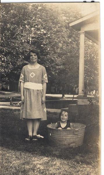 Mom in the tub, her wonderful sister Liz watching