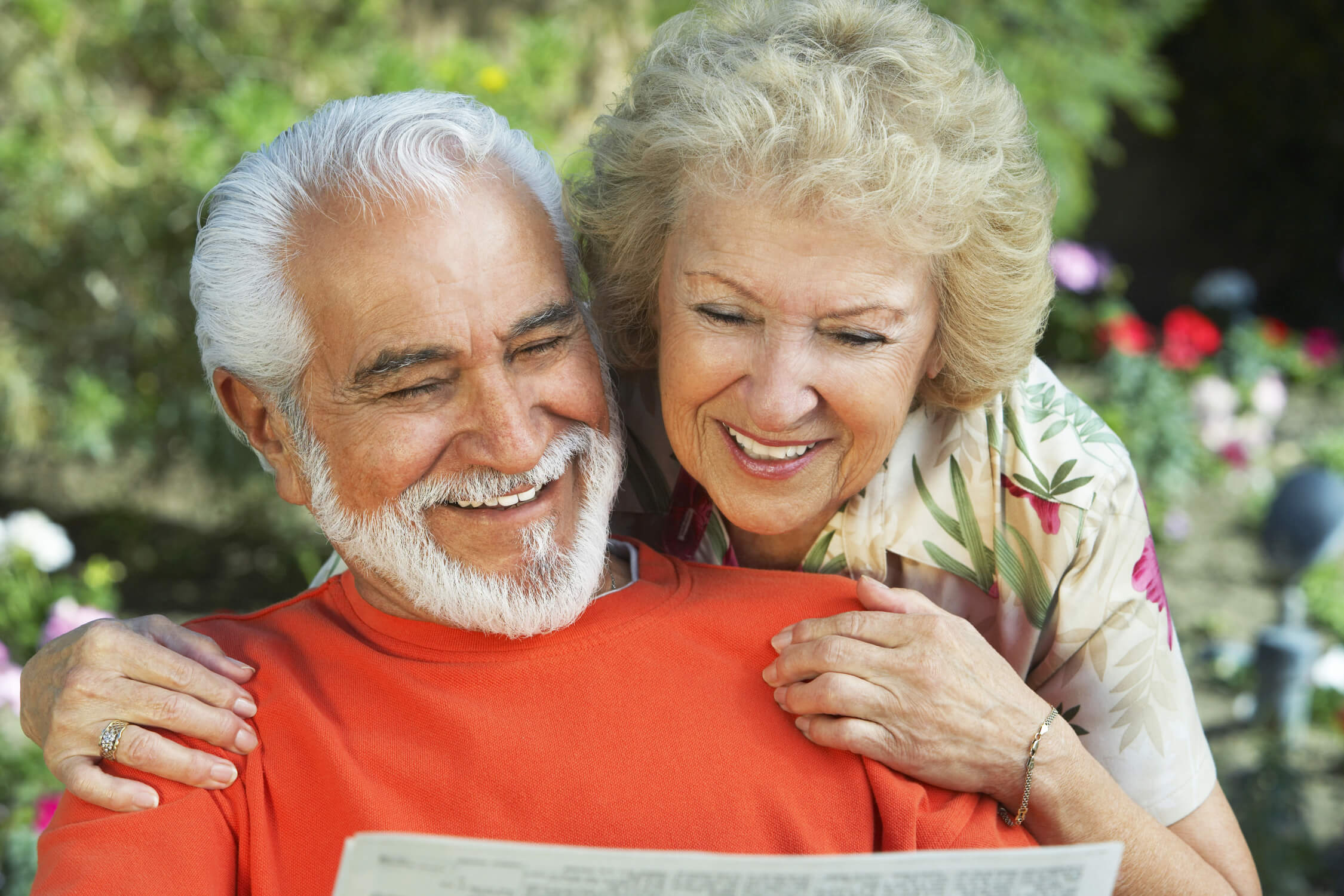 Old Man & Woman Reading a Paper