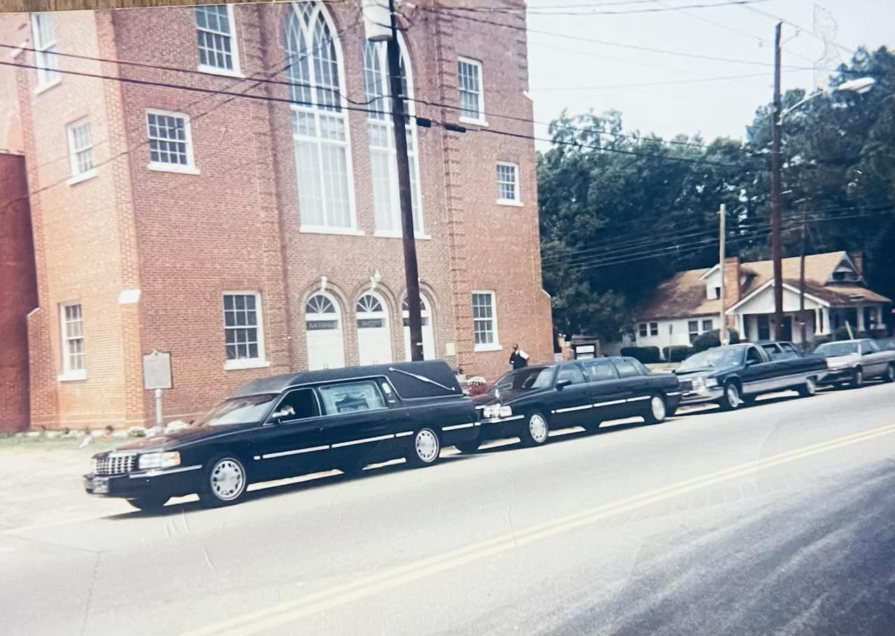 Hearse and limos in front of Macedonia Baptist Church
