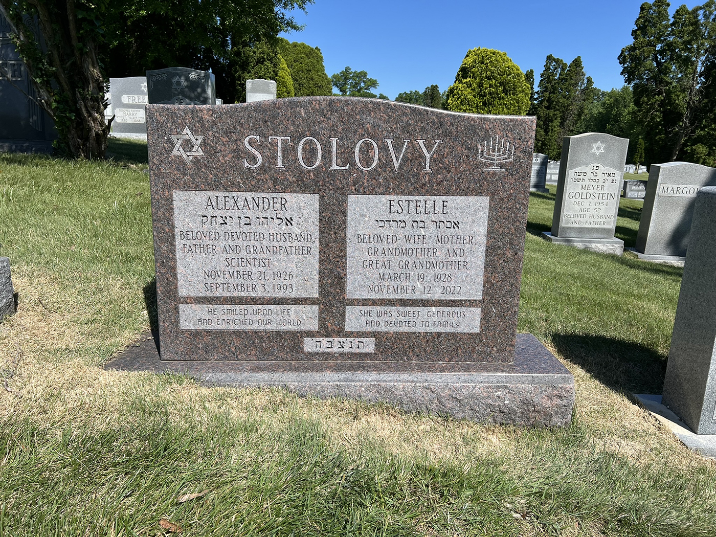 Companion granite monument with later inscription, featuring perfectly aligned engravings to honor a beloved couple