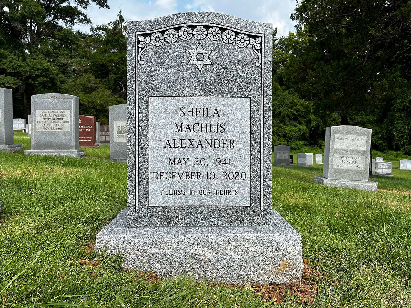 Custom granite headstone with Jewish symbols, designed for a meaningful and lasting tribute