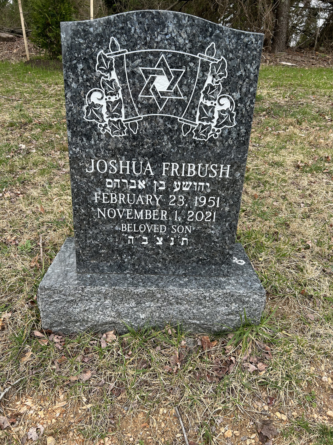Custom granite tombstone made from Blue Pearl granite, with a shimmering surface and personalized engravings honoring a loved one’s legacy.