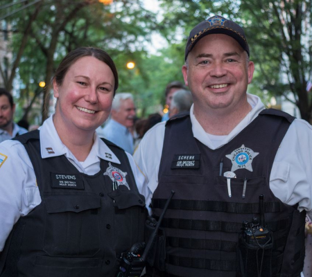 Two police officers smiling
