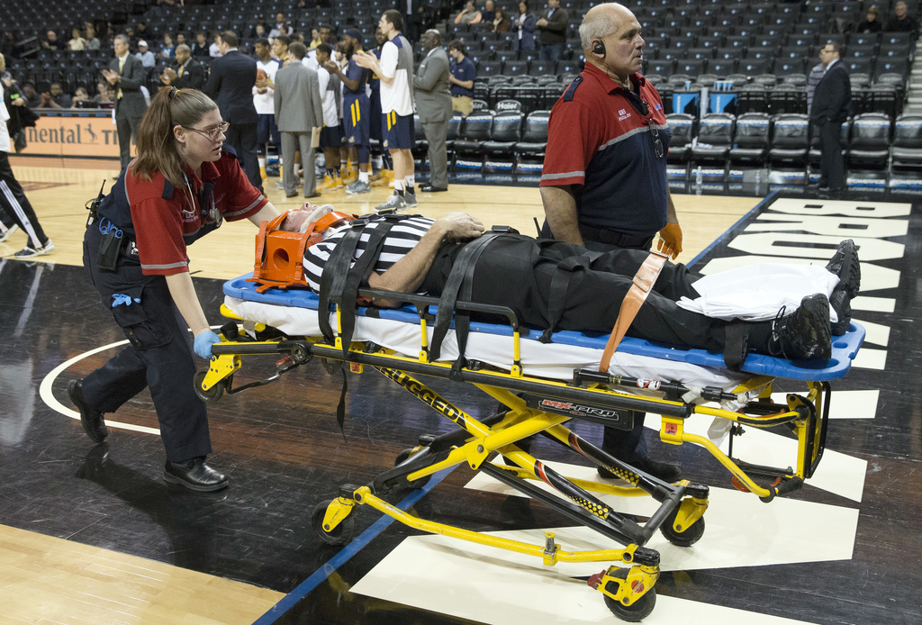 Referee injured and stretchered off court