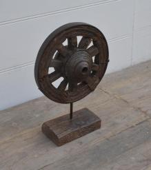 SOLID WOOD WHEEL MOUNTED ON STAND 