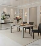 EXTENDABLE SOLID WOOD DINING TABLE W/ SELF-STORING EXTENSIONS