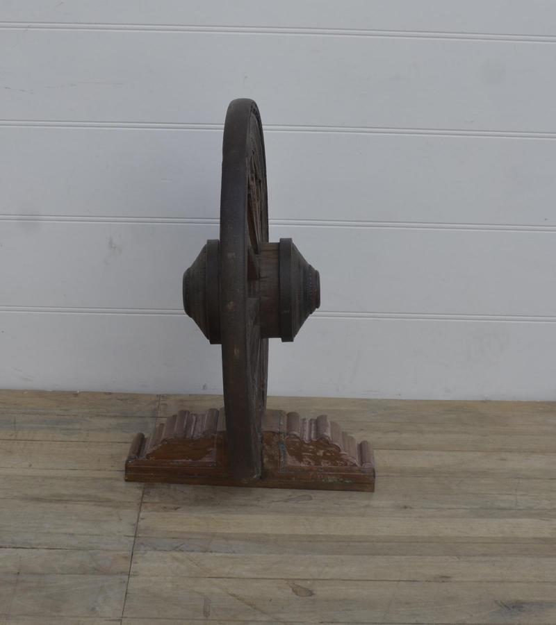 WOODEN WHEEL ON STAND