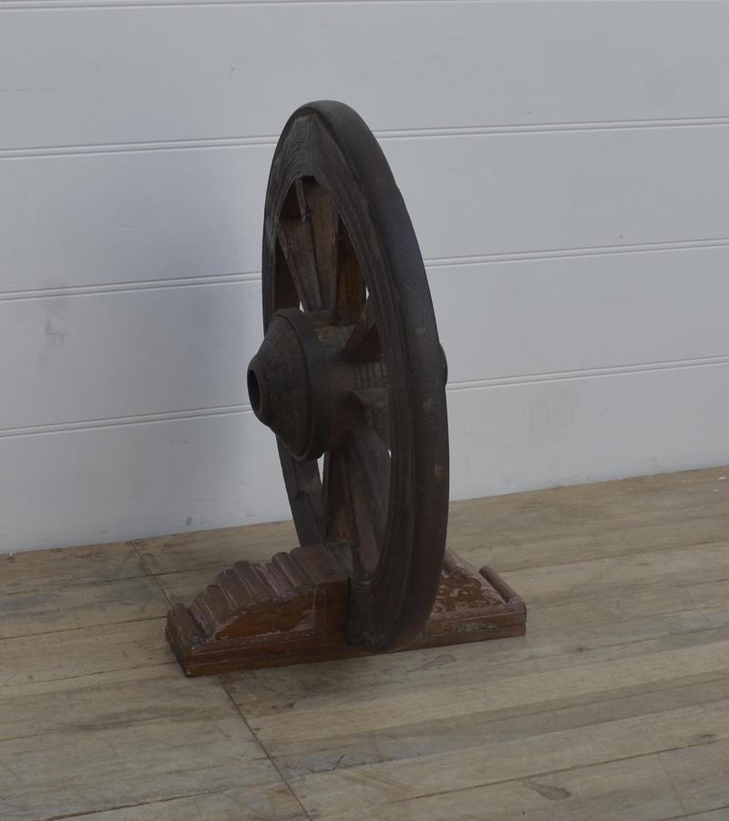 WOODEN WHEEL ON STAND