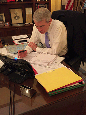 Sen. Rob Portman (R-OH) speaks with business owners from his desk in Washington, DC.