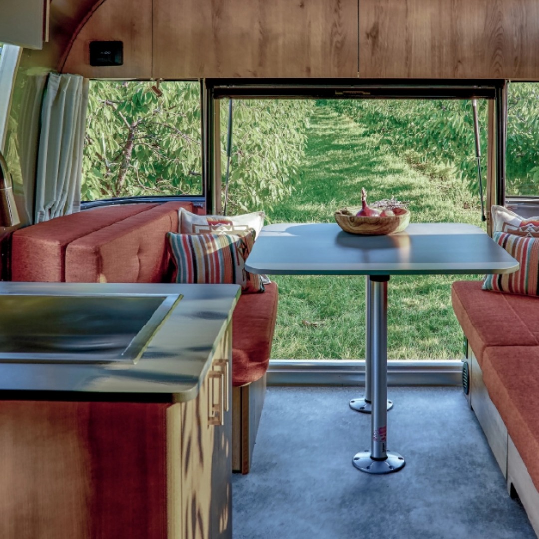 Interior of the Airstream Trade Wind 23FB Dinnete|Airstream's Frank Lloyd Wright Limited Edition Travel Trailer Twin Bed and Dinnete Floorplan outline|Airstream's 2025 Trade Wind 25FB Travel Trailer Floorplan outline|Airstream's Caravel 22FB Travel Trailer Floorplan outline|Exterior image of Airstreams Flying Cloud Travel Trailer in the Midnight Flamingo Upgrade|Airstream 30FB Bunk Flying Cloud Travel Trailer Floorplan outline|Airstream's Basecamp 20 Travel Trailer Floorplan outline|Interior Image of Airstream's Flying Cloud Travel Trailer 2025|Lifestyle image of a family playing outside of the Flying Cloud Travel Trailer|Airstream's Basecamp 20 Travel Trailer Floorplan outline
