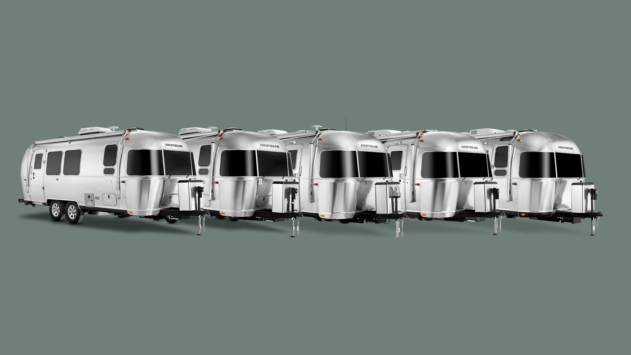 All of Airstream's dual axle travel trailers lined up in a line on a green background.|2023 Airstream International Travel Trailer on a white background|Airstream Globetrotter-Travel-Trailer|All of Airstream's dual axle travel trailers lined up in a line on a green background.|All of Airstream's dual axle travel trailers lined up in a line on a green background.|Trade-Wind-Primary-Image|trade-wind-Answers-to-common-Qs|AIRMKT FLW 2025 1920x1080 3-4 view