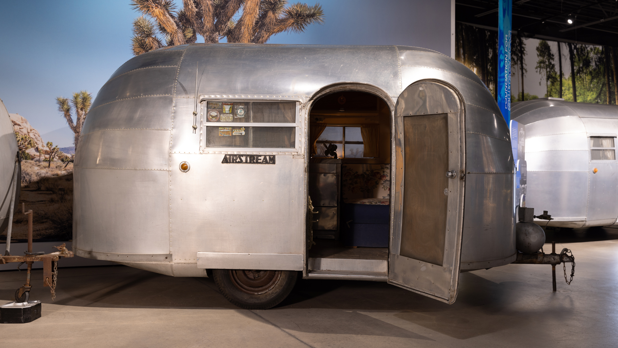 Wee-Wind-Desktop-Banner-Image|Airstream Vintage Wee Wind named Ruby sitting outside|Ruby-the-Wee-Wind-Interior|Ruby-the-Wee-Wind-butane-tank|Ruby-the-Wee-Wind-Sleep-cover|Ruby-the-Wee-Wind-tag|Ruby-the-Wee-Wind-owner|Ruby-the-Wee-Wind-driving|Ruby--a-1948-Wee-Wind-Desktop-Banner-Image|Ruby--a-1948-Wee-Wind-Mobile-Banner-Image|Wee-Wind-Beinf-Transported|Wee-Wind-Owner|Wee-Wind-Mobile-Banner-Image