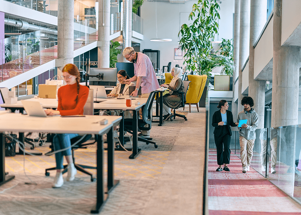 People working in colorful modern startup office