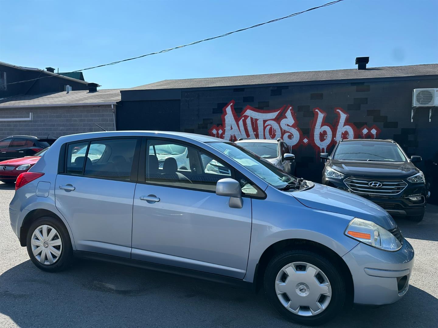 Blue 2009 Nissan Versa Sedan Front-Wheel Drive Automatic