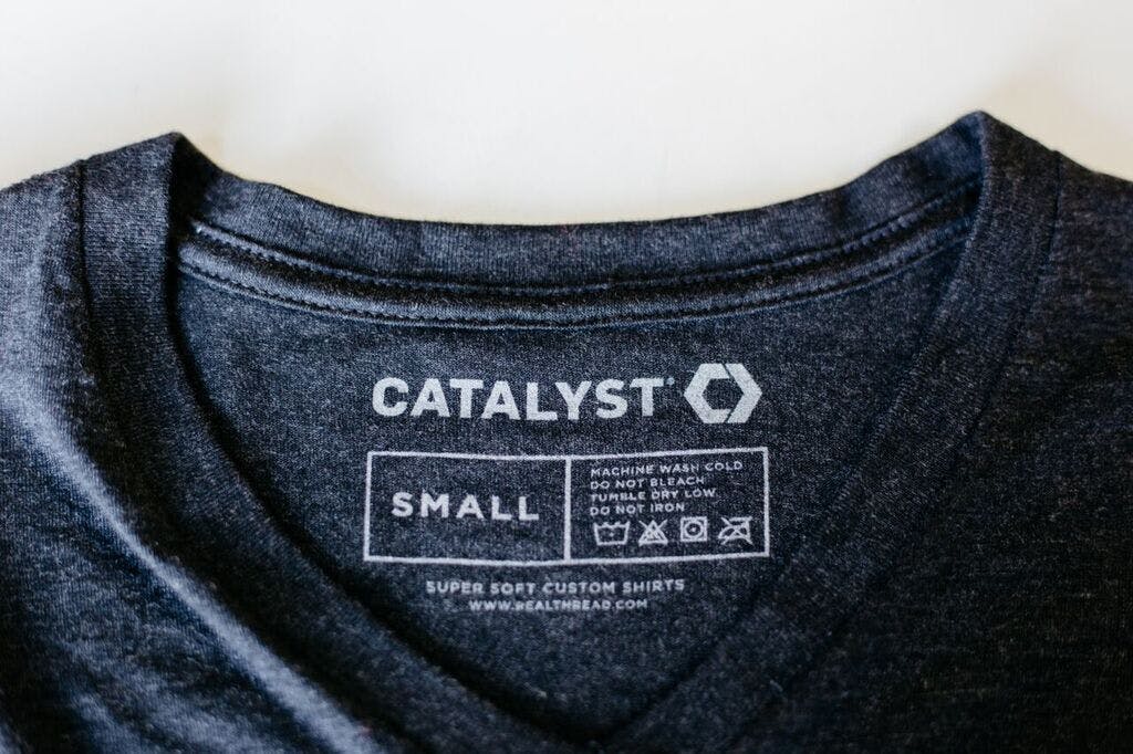 navy shirt with a printed tage