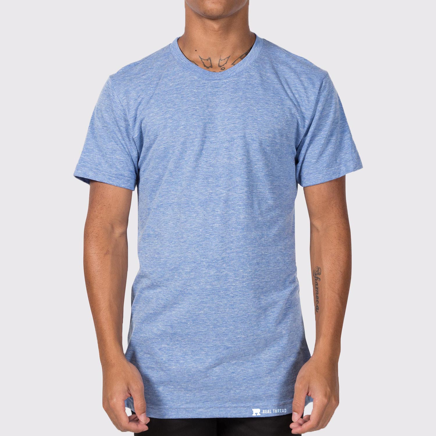 a man wearing a light blue tri-blend t-shirt