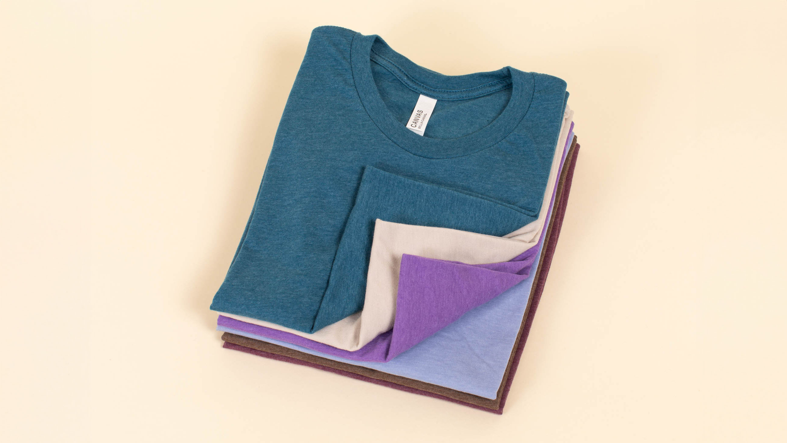 a stack of folded t-shirts