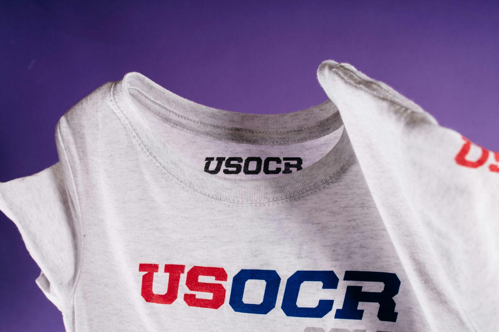 USOCR t-shirt with purple background