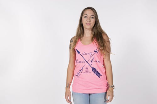women wearing a pink tank top in a photoshoot
