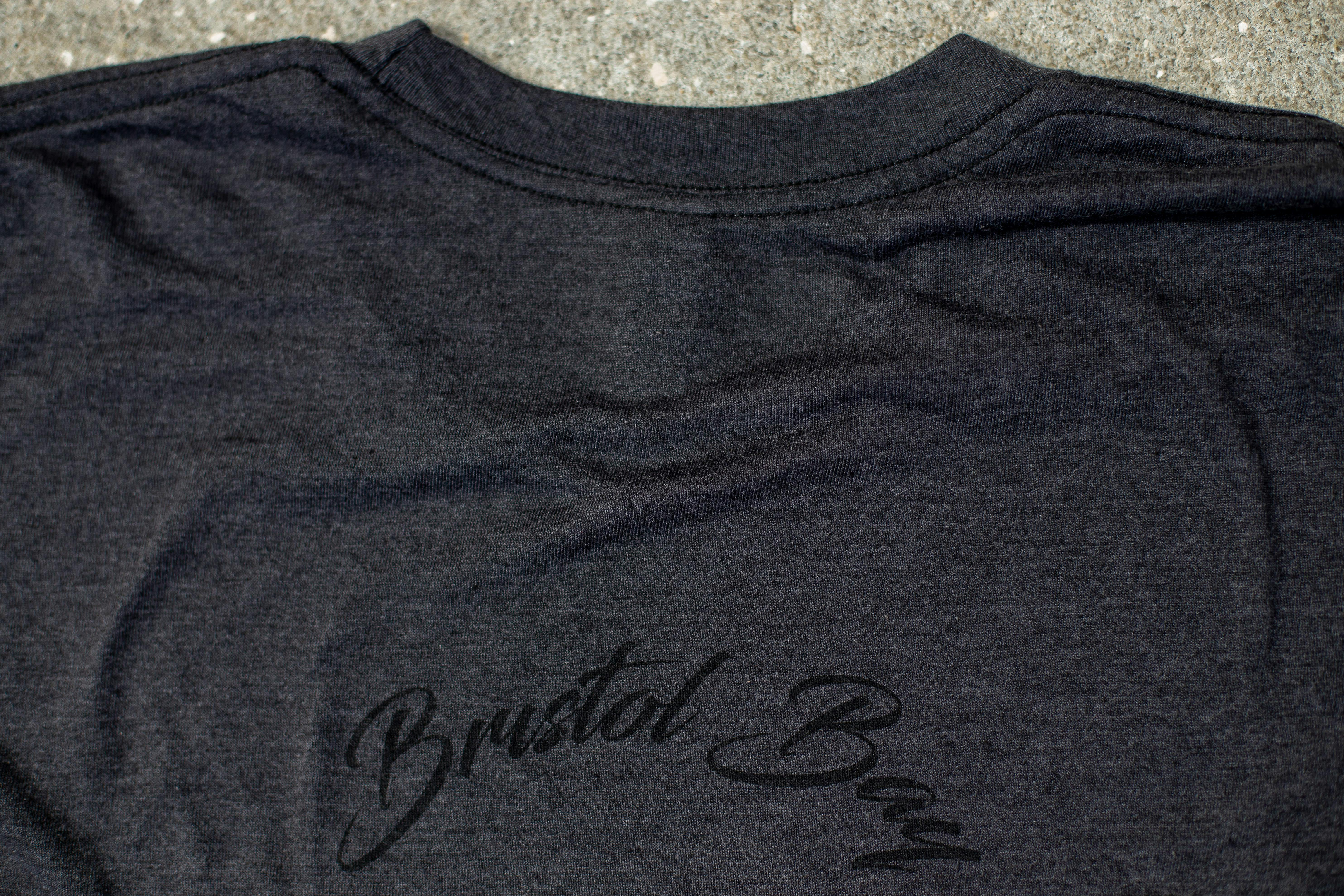 back of a black shirt with black ink