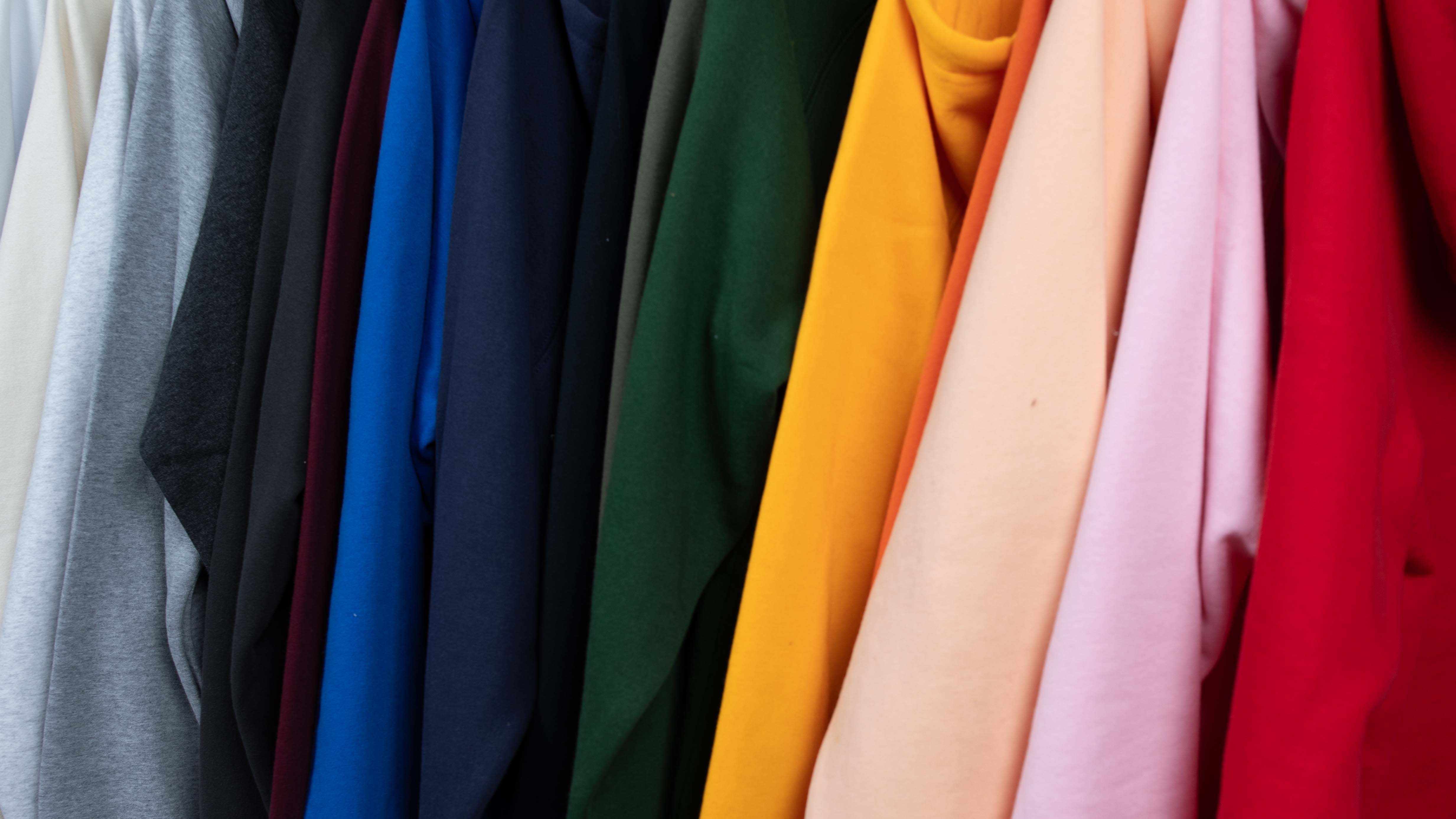 an assorted color of hoodies