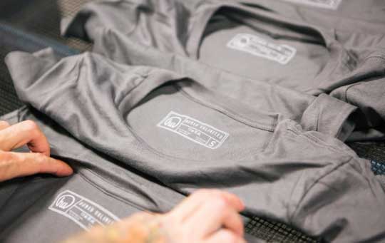 gray shirt with printed tags