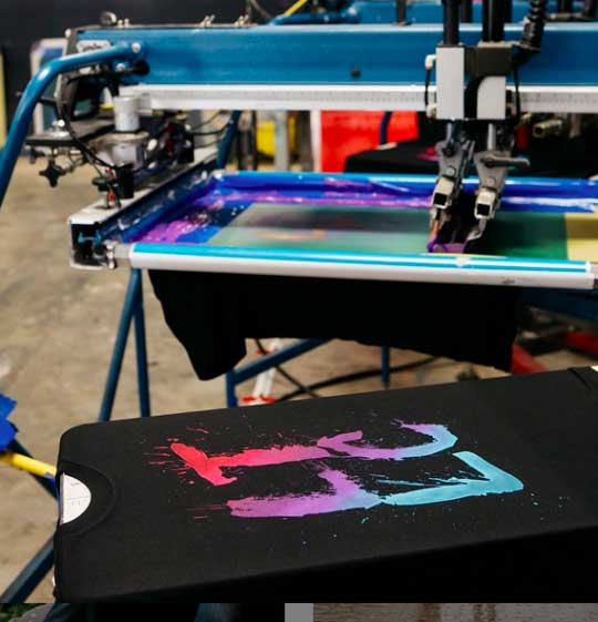 black t-shirt on a press