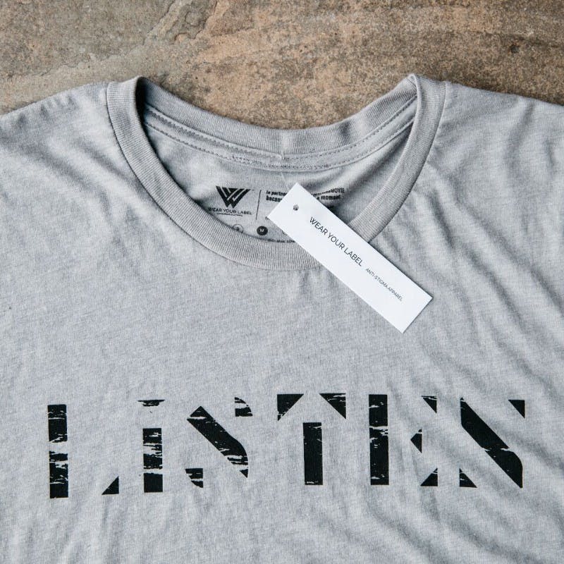 hang tag on a gray shirt
