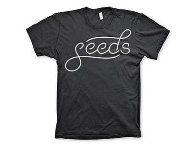 black shirt with the words seeds printed on it