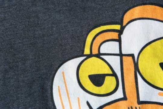 close up of grey shirt with printed graphic 
