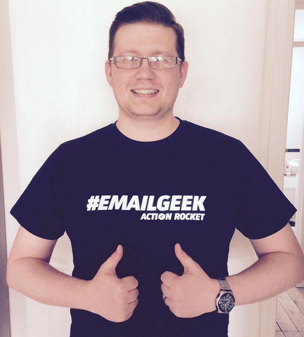 man wearing a t-shirt with #emailgeek printed on it