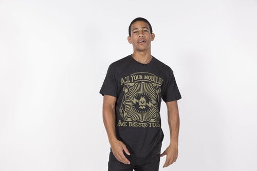 man wearing black t-shirt and gold printing