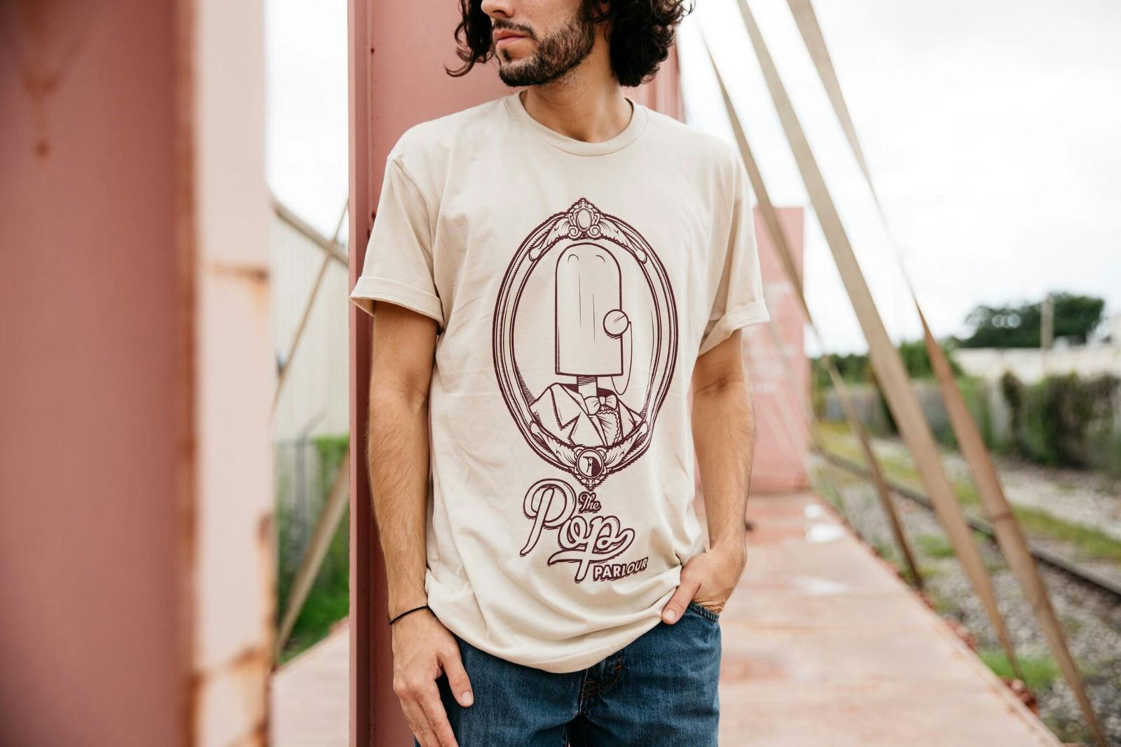 man wearing a cream color shirt