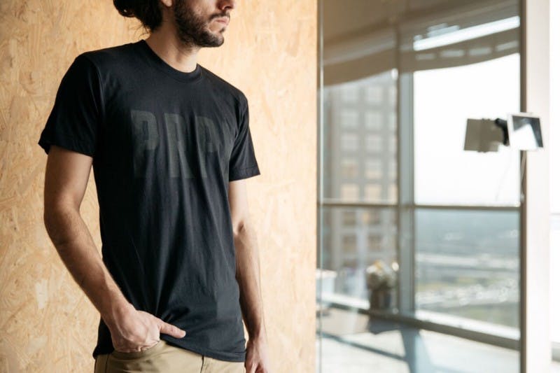 guy wearing a black shirt looking outside