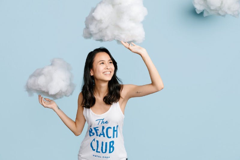 women holding up clouds