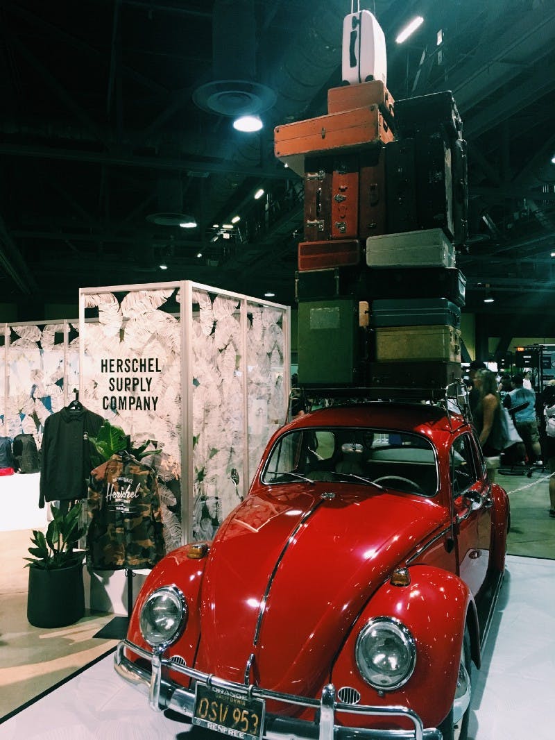 Red VW with suitcases stacked on top
