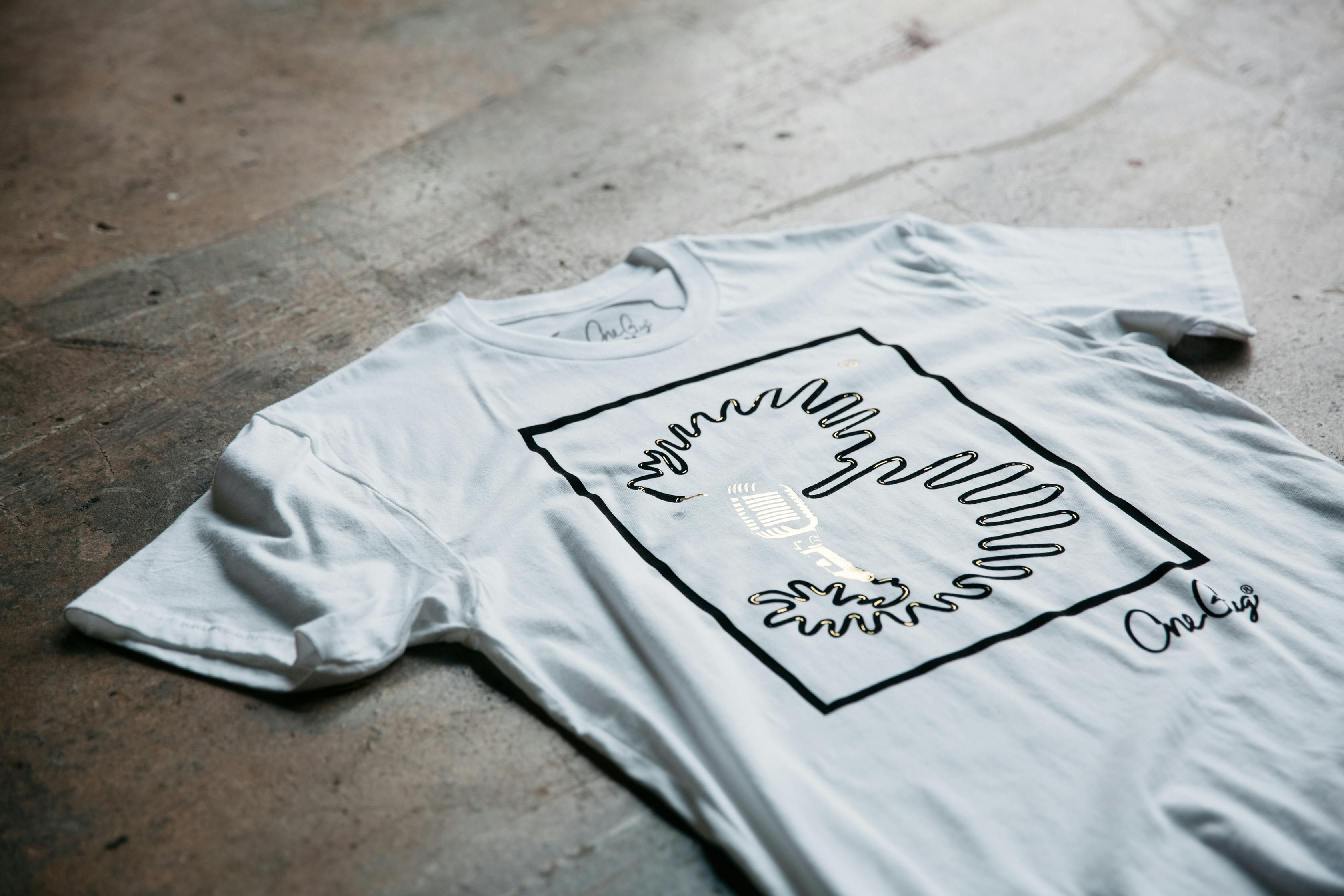 white shirt on the floor with a black imprint