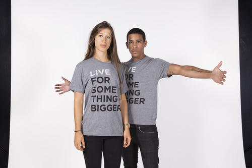 two people wearing a gray shirt in a photo 