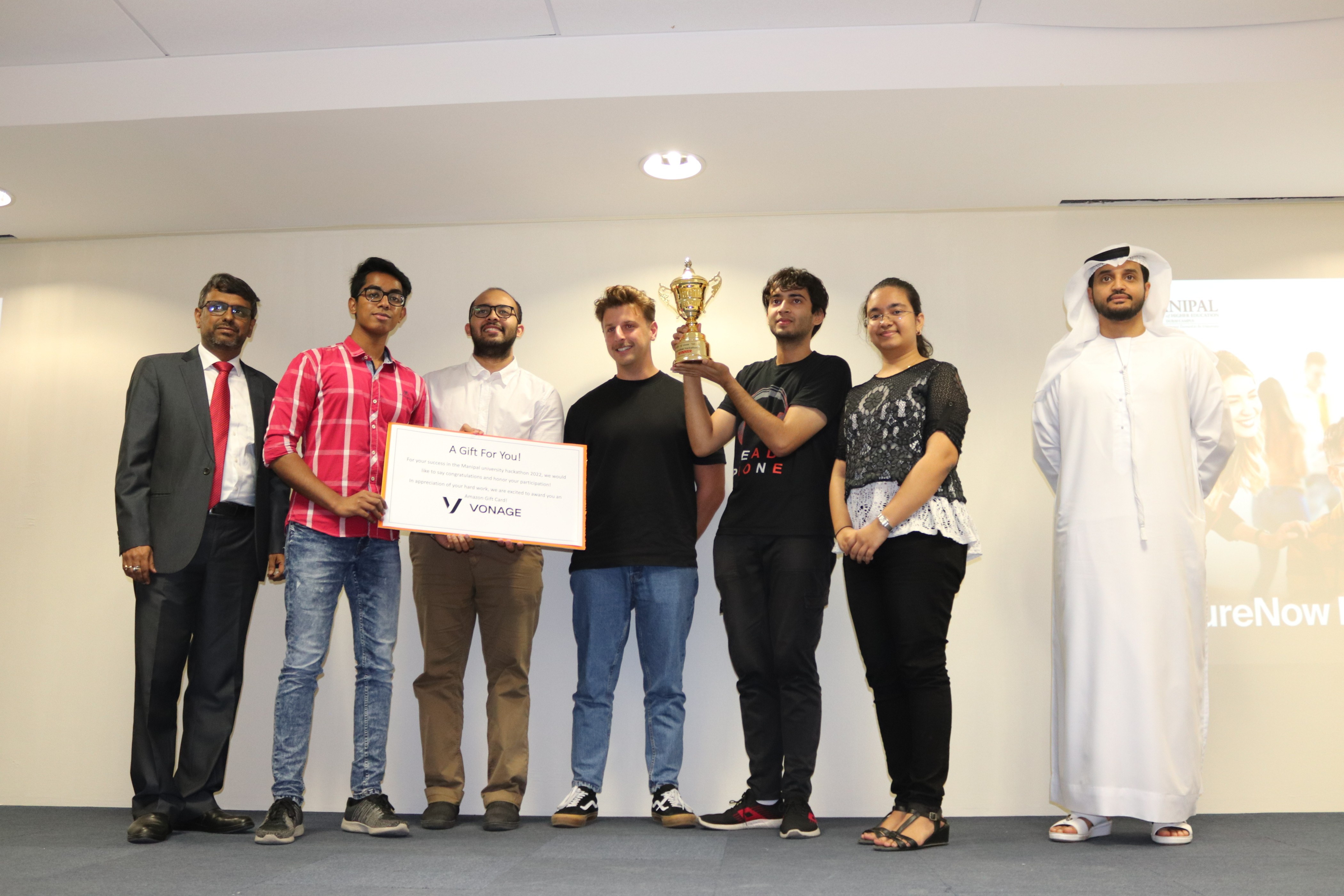 The quadKernals team accepting their victory trophy.